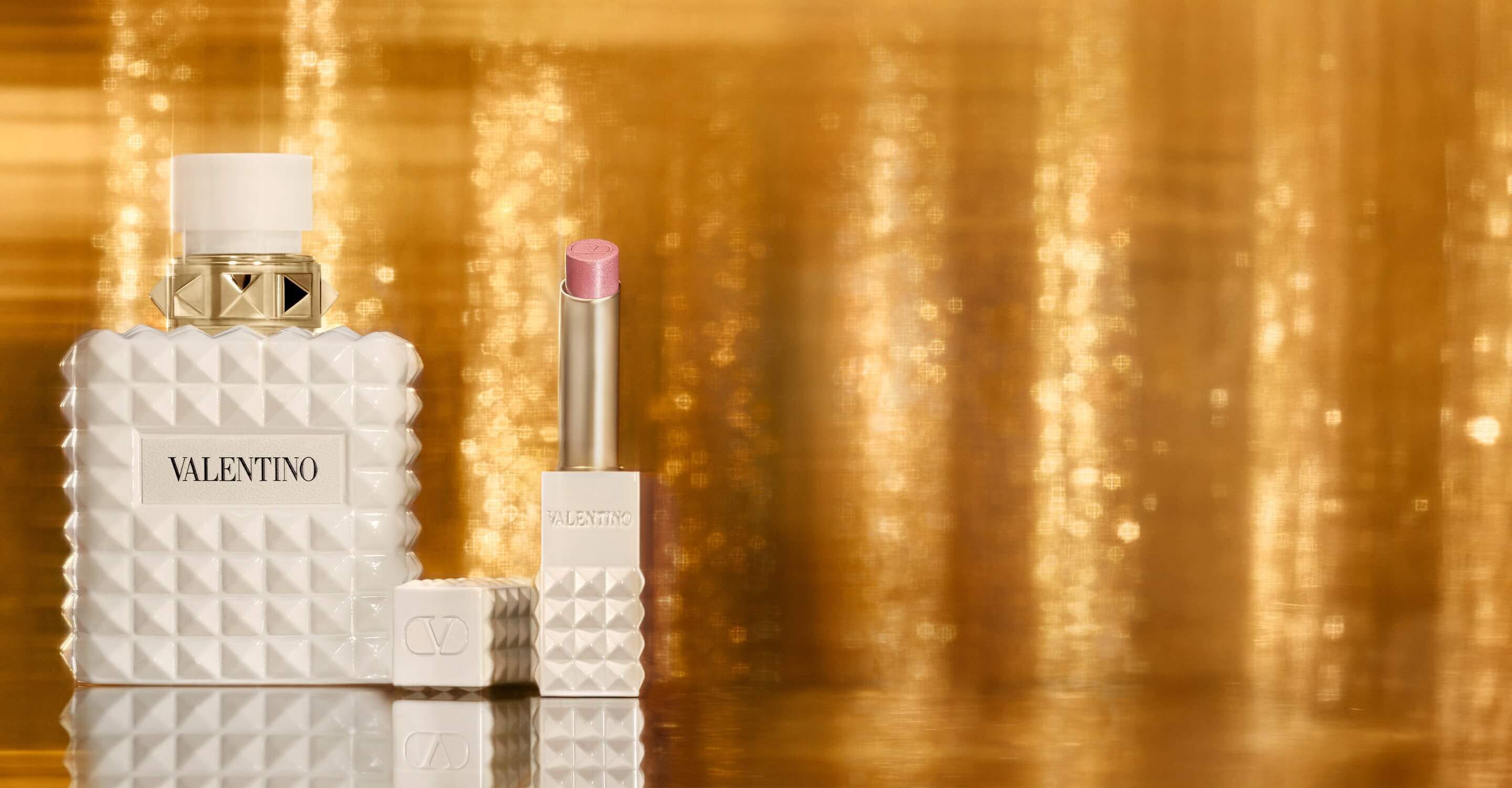 SPIKE VALENTINO IVORY placed against a backdrop of shimmering gold