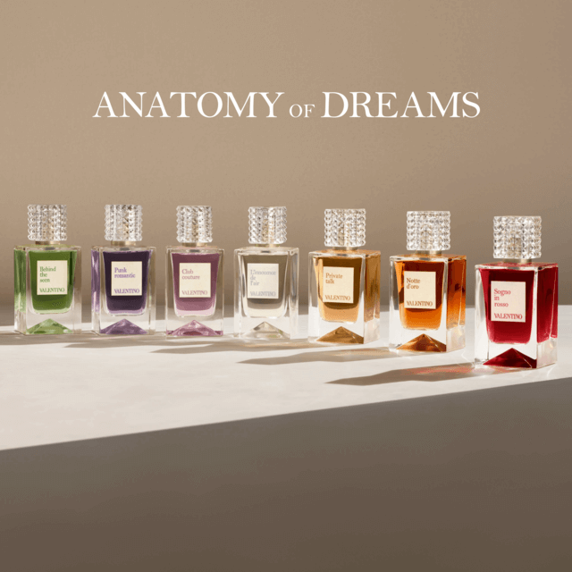 Eight luxurious perfume bottles arranged in a row, each with distinct colors and labels, set against a minimalist backdrop.