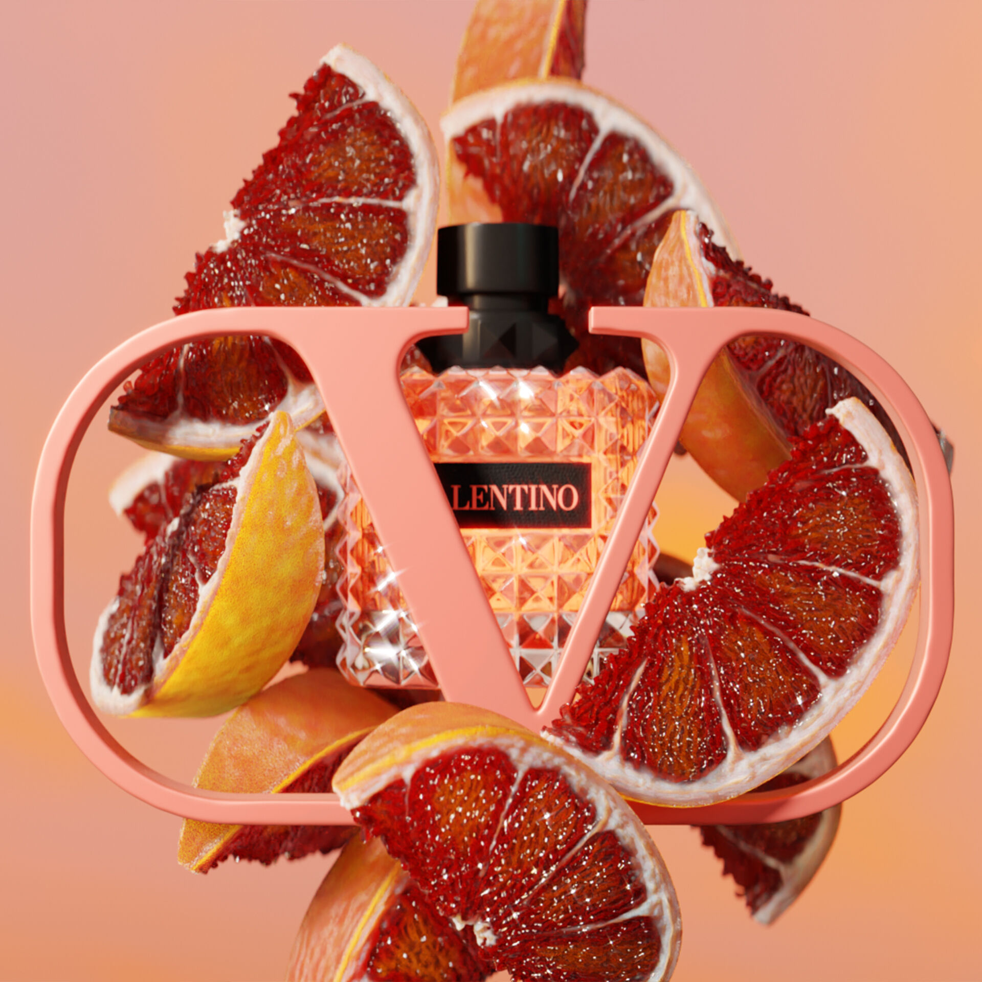 A vibrant display featuring a crystal bottle of Valentino perfume surrounded by slices of blood orange, set against a soft gradient background. The bottle is framed by a stylish "V" design in coral pink.