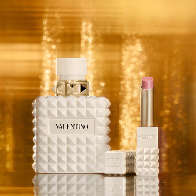 SPIKE VALENTINO IVORY placed against a backdrop of shimmering gold